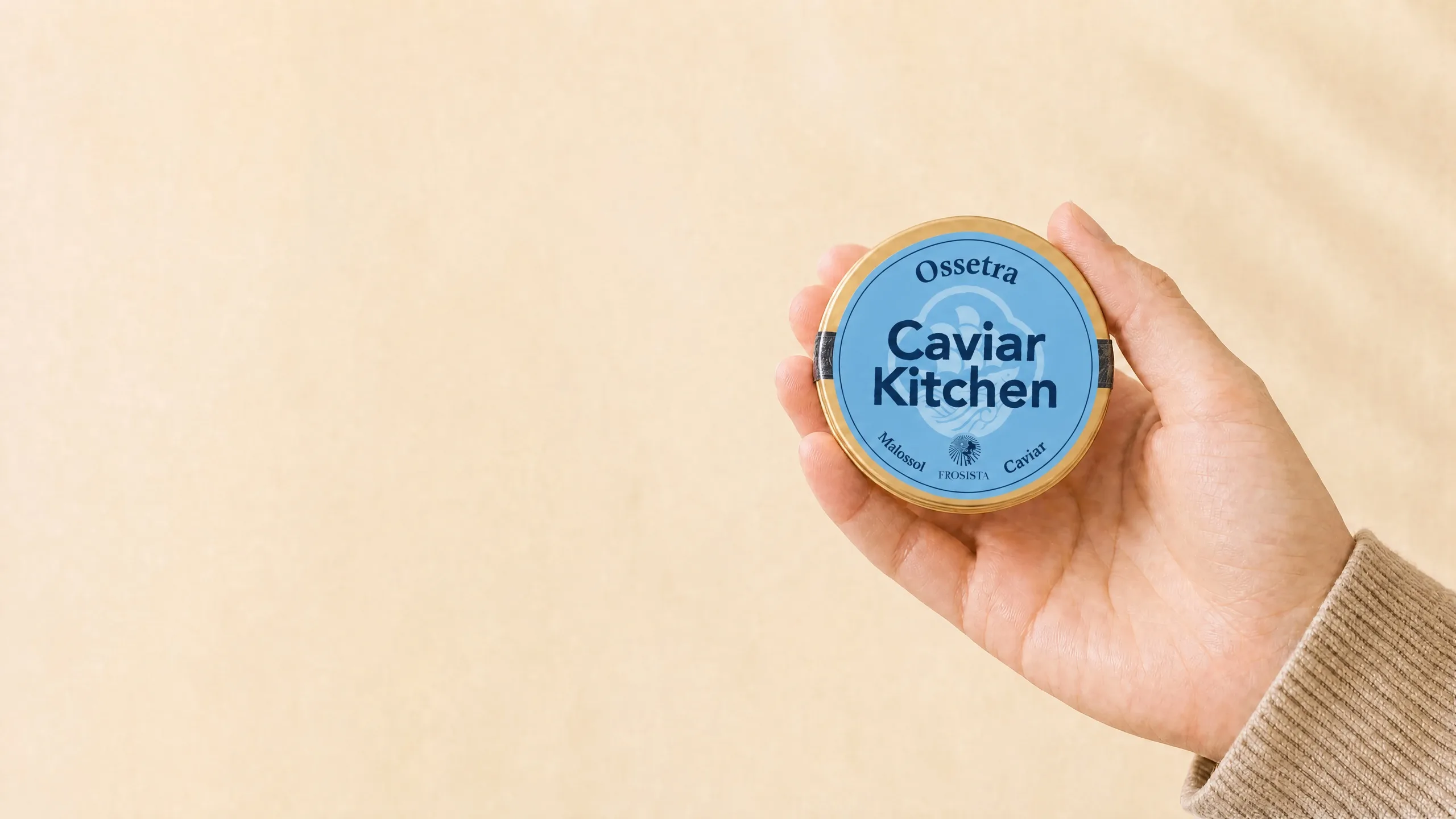 A hand holding a Caviar Kitchen Kaluga Hybrid tin with its species name on the label.
